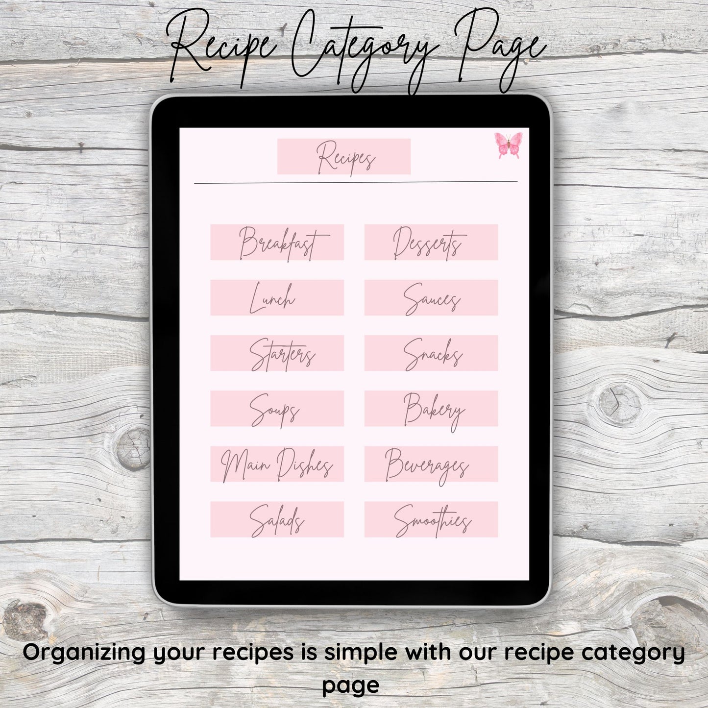 Black tablet laying on grey and white wooden desk.  Tablet displays digital recipe category page.