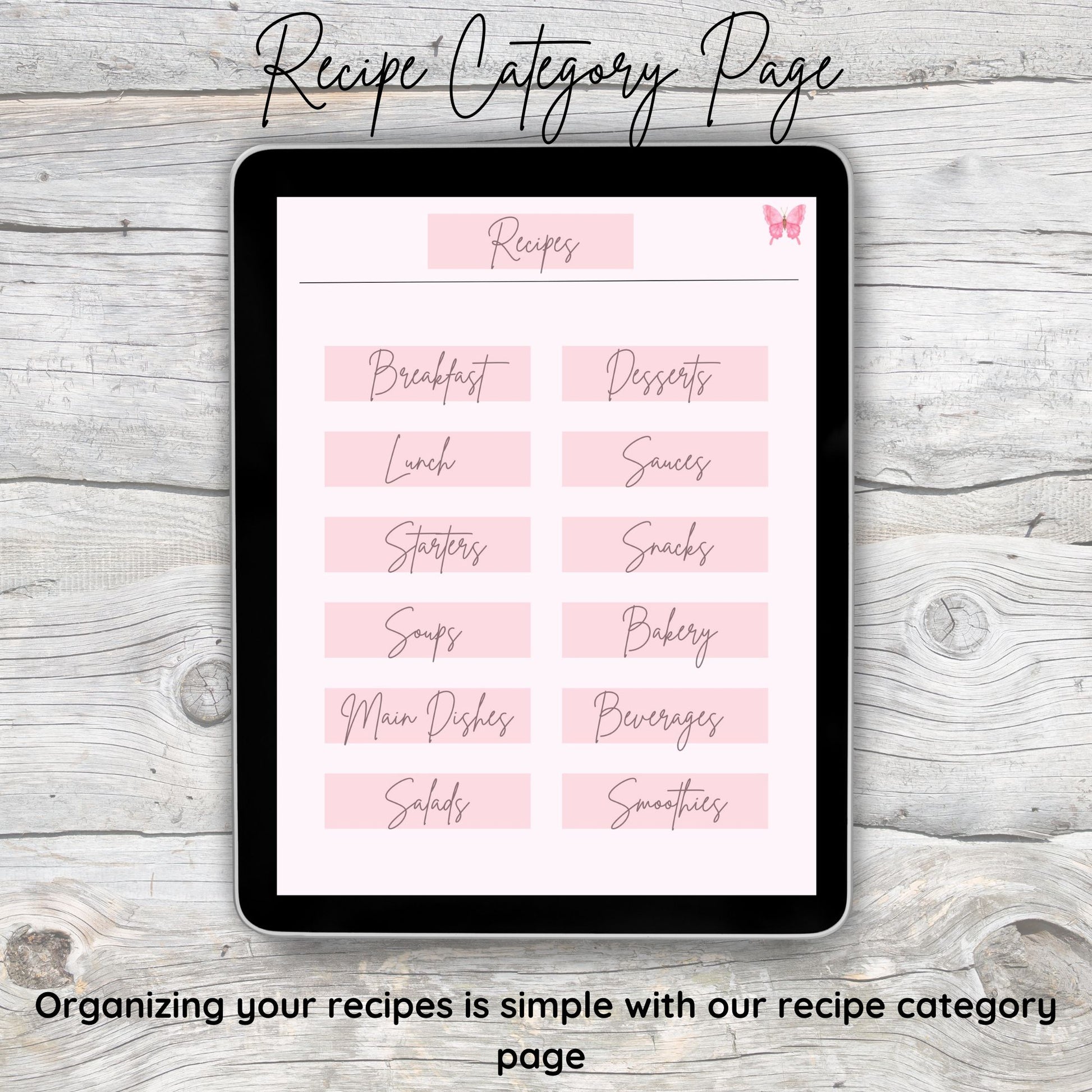 Black tablet laying on grey and white wooden desk.  Tablet displays digital recipe category page.